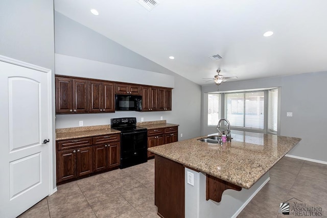 6257 E 47th St, Yuma, AZ 85365 - kitchen with black appliances, ceiling fan, lofted ceiling, light tile patterned floors, and a breakfast bar