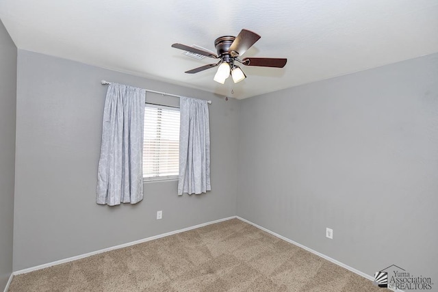 6257 E 47th St, Yuma, AZ 85365 - carpeted spare room with baseboards and a ceiling fan
