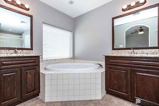 6257 E 47th St, Yuma, AZ 85365 - bathroom featuring tile patterned floors, two vanities, a bath, and a ceiling fan