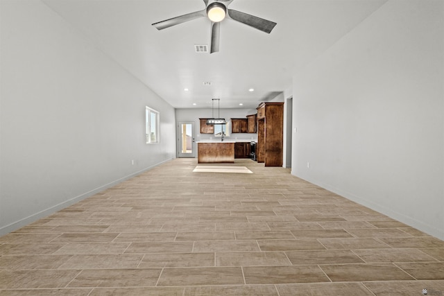 10770 E 45th Ln, Yuma, AZ 85367 - unfurnished living room with a ceiling fan, light wood finished floors, and recessed lighting