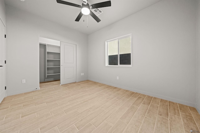 10770 E 45th Ln, Yuma, AZ 85367 - unfurnished bedroom featuring light wood finished floors, ceiling fan, and a closet