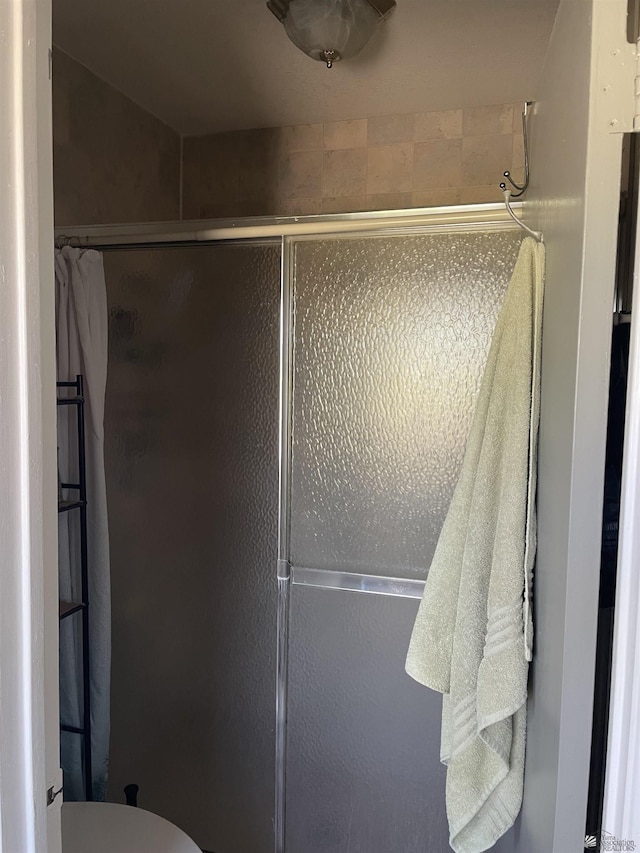 1603 S 31st Dr, Yuma, AZ 85364 - bathroom featuring a shower stall and toilet