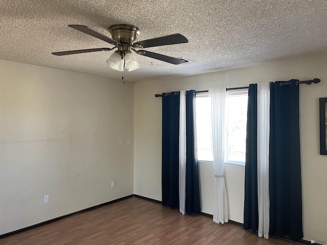 1603 S 31st Dr, Yuma, AZ 85364 - empty room with wood finished floors, a textured ceiling, and a ceiling fan