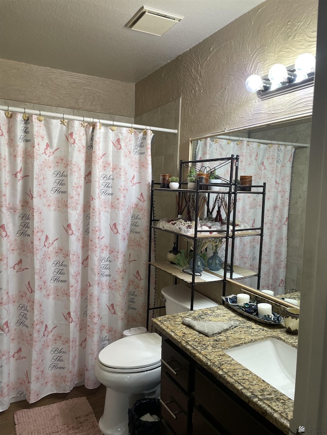 1603 S 31st Dr, Yuma, AZ 85364 - bathroom with vanity, a textured ceiling, a shower with curtain, and a textured wall