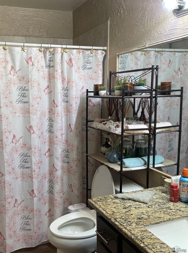 1603 S 31st Dr, Yuma, AZ 85364 - bathroom featuring vanity, toilet, and a shower with curtain