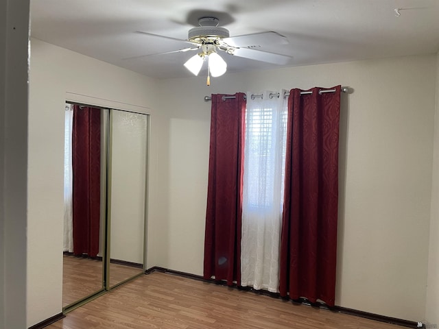 1603 S 31st Dr, Yuma, AZ 85364 - unfurnished bedroom with wood finished floors, a ceiling fan, and a closet