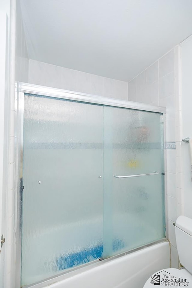 1358 S 22nd Ave, Yuma, AZ 85364 - full bathroom with toilet and bath / shower combo with glass door