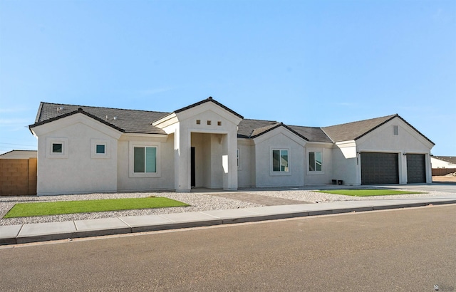 5922 E 47th St, Yuma, AZ 85365 - modern inspired farmhouse with an attached garage, stucco siding, and driveway