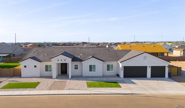 5922 E 47th St, Yuma, AZ 85365 - single story home with stucco siding, an attached garage, a residential view, and concrete driveway
