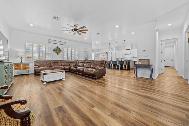 5922 E 47th St, Yuma, AZ 85365 - living room featuring a ceiling fan, light wood-style flooring, and recessed lighting