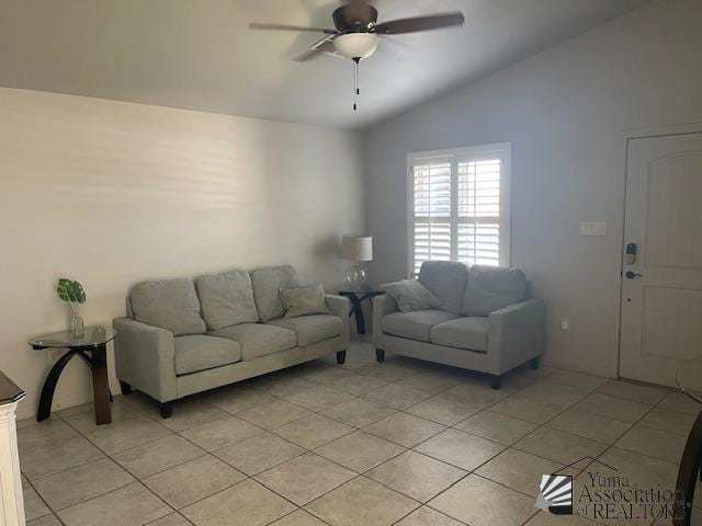 living room featuring light tile patterned floors, ceiling fan, and vaulted ceiling