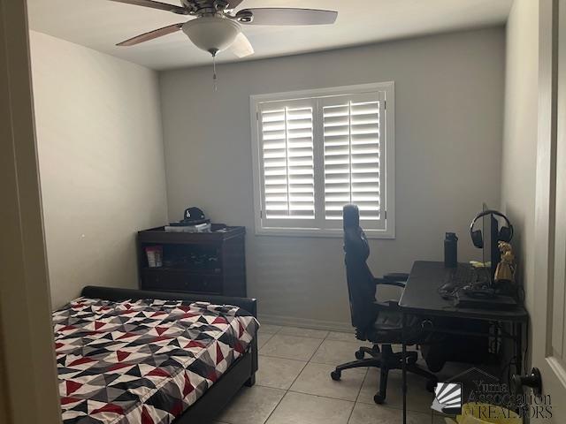 bedroom featuring light tile patterned floors and a ceiling fan
