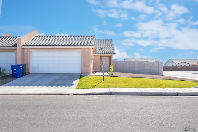 3633 E Desert Sky Dr, Yuma, AZ 85365 - multi unit property with a garage, fence, stucco siding, concrete driveway, and a tile roof