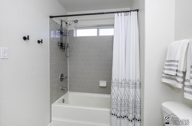 bathroom with toilet and shower / tub combo