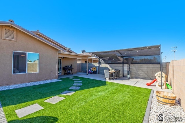 view of yard with a fenced backyard and a patio area