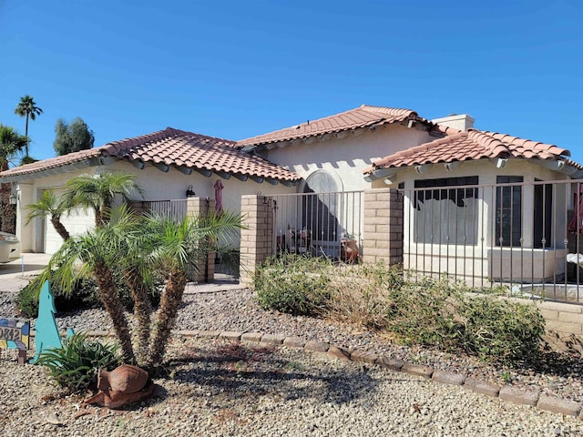 10842 S Via Salida, Yuma, AZ 85367 - mediterranean / spanish-style house featuring stucco siding, a garage, fence, and a tile roof