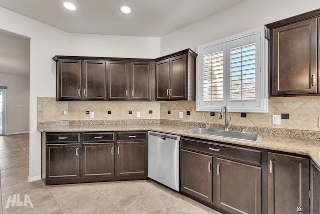 kitchen featuring backsplash, stainless steel dishwasher, dark brown cabinets, a sink, and light countertops
