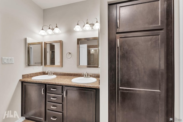 full bath with double vanity and a sink