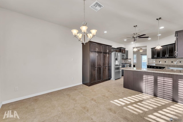 kitchen featuring visible vents, appliances with stainless steel finishes, a sink, ceiling fan with notable chandelier, and recessed lighting