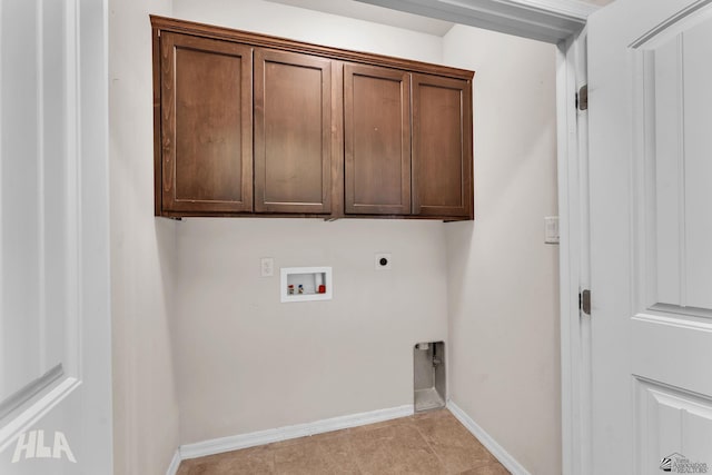 laundry room with cabinet space, light tile patterned flooring, hookup for a washing machine, baseboards, and hookup for an electric dryer