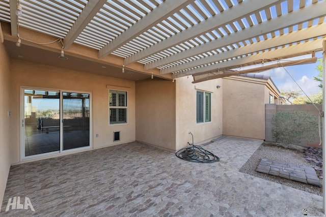 view of patio / terrace featuring fence