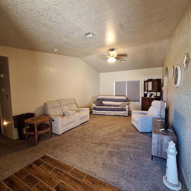 6397 E 42nd St, Yuma, AZ 85365 - carpeted living area featuring ceiling fan, wood finish floors, a textured ceiling, arched walkways, and lofted ceiling