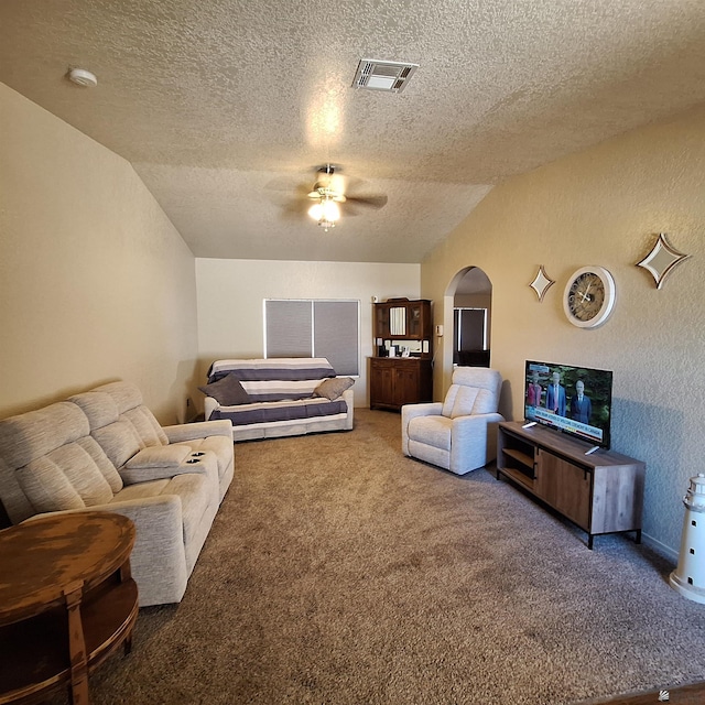 6397 E 42nd St, Yuma, AZ 85365 - carpeted bedroom with arched walkways, a textured ceiling, a ceiling fan, a textured wall, and lofted ceiling