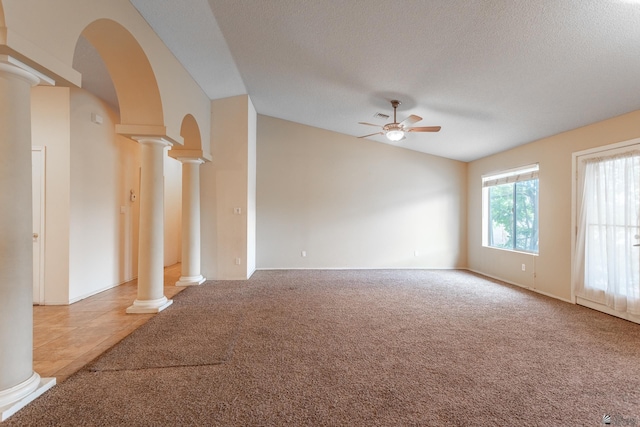 1653 S 42nd Ave, Yuma, AZ 85364 - unfurnished living room with ornate columns, a ceiling fan, lofted ceiling, carpet floors, and arched walkways