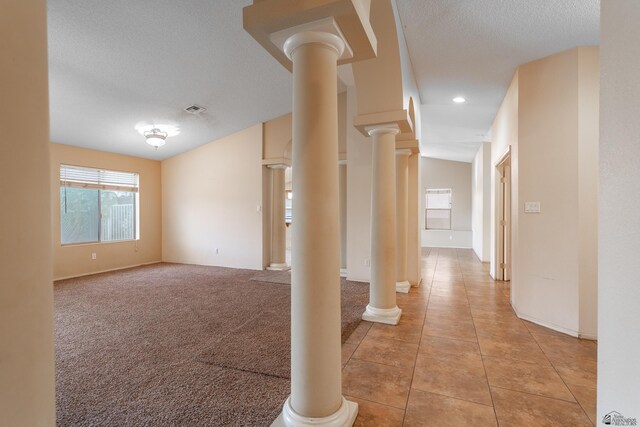 1653 S 42nd Ave, Yuma, AZ 85364 - hallway with a textured ceiling, baseboards, light tile patterned flooring, ornate columns, and recessed lighting