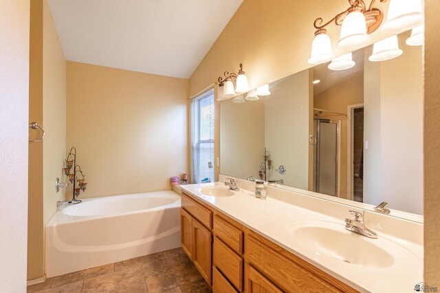 1653 S 42nd Ave, Yuma, AZ 85364 - bathroom featuring a garden tub, a shower stall, double vanity, and vaulted ceiling