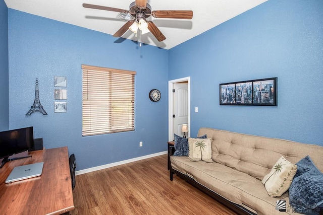 12147 E 33rd St, Yuma, AZ 85367 - living area featuring baseboards, a ceiling fan, and wood finished floors