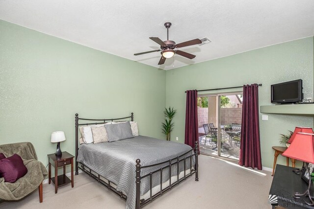 12147 E 33rd St, Yuma, AZ 85367 - carpeted bedroom with access to outside, a ceiling fan, and visible vents