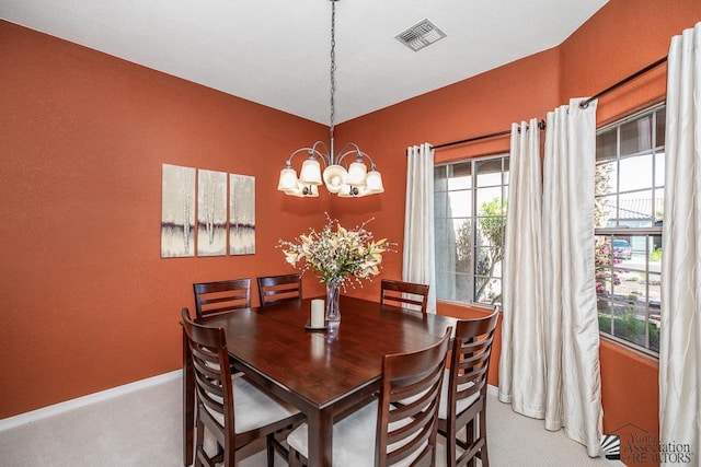 12147 E 33rd St, Yuma, AZ 85367 - dining space with a notable chandelier, visible vents, baseboards, and carpet