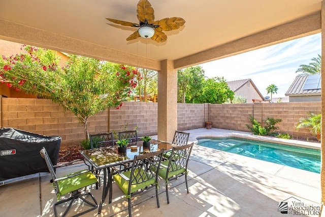 12147 E 33rd St, Yuma, AZ 85367 - view of patio / terrace featuring a fenced backyard, a ceiling fan, outdoor dining space, and a fenced in pool