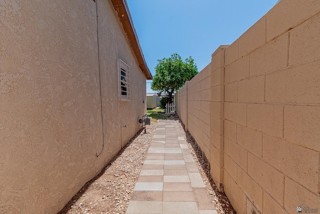 1221 S 10th Ave, Yuma, AZ 85364 - view of side of home featuring stucco siding