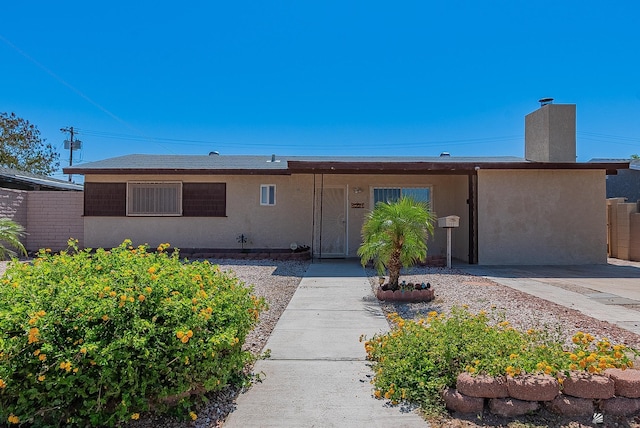 1221 S 10th Ave, Yuma, AZ 85364 - ranch-style home featuring stucco siding and a chimney