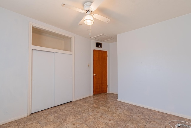 1221 S 10th Ave, Yuma, AZ 85364 - unfurnished bedroom featuring a closet and a ceiling fan