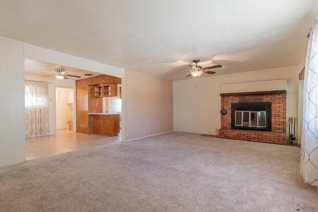 1221 S 10th Ave, Yuma, AZ 85364 - unfurnished living room featuring a ceiling fan, carpet floors, and a brick fireplace