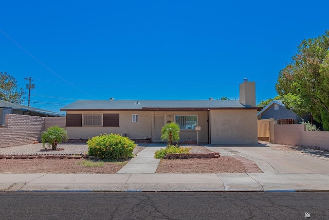 1221 S 10th Ave, Yuma, AZ 85364 - ranch-style home with stucco siding and a chimney