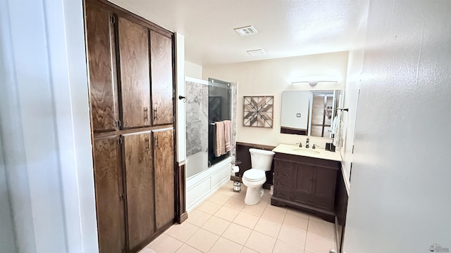 1766 W Camino Kino, Yuma, AZ 85364 - full bathroom with toilet, tile patterned floors, vanity, and enclosed tub / shower combo