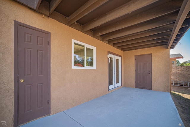 property entrance featuring a patio area