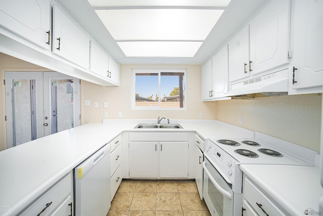 kitchen featuring kitchen peninsula, white appliances, white cabinetry, and sink