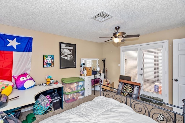 1465 E Laguna Pl Unit 4, Yuma, AZ 85365 - carpeted bedroom featuring access to outside, ceiling fan, visible vents, and a textured ceiling