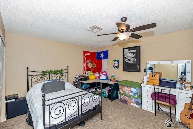 1465 E Laguna Pl Unit 4, Yuma, AZ 85365 - carpeted bedroom with visible vents, a textured ceiling, and ceiling fan