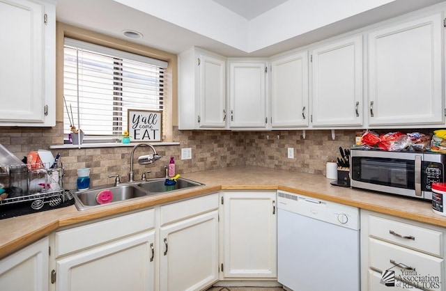 1465 E Laguna Pl Unit 4, Yuma, AZ 85365 - kitchen with white cabinets, a sink, dishwasher, light countertops, and stainless steel microwave