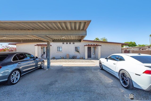 1465 E Laguna Pl Unit 4, Yuma, AZ 85365 - view of front of property with covered and uncovered parking and stucco siding