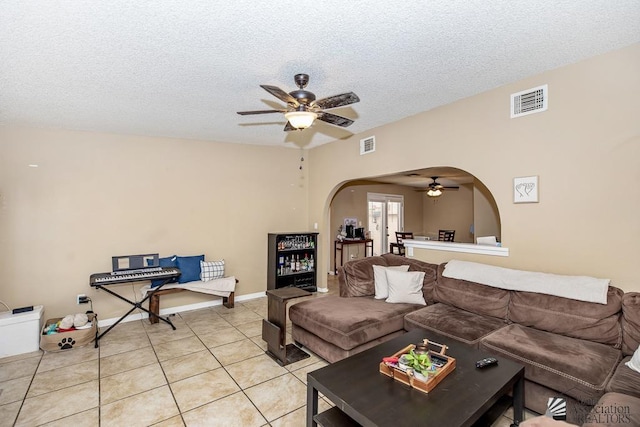 1465 E Laguna Pl Unit 4, Yuma, AZ 85365 - living room featuring a ceiling fan, arched walkways, visible vents, and a textured ceiling