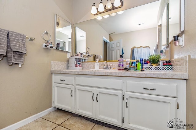 1465 E Laguna Pl Unit 4, Yuma, AZ 85365 - bathroom with vanity, tile patterned flooring, and baseboards