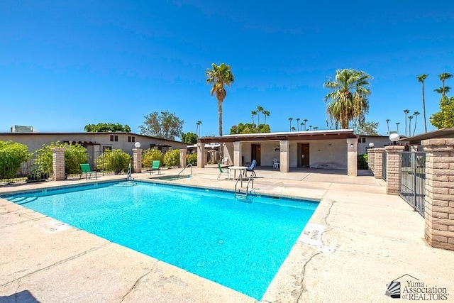 1465 E Laguna Pl Unit 4, Yuma, AZ 85365 - community pool featuring a patio and fence