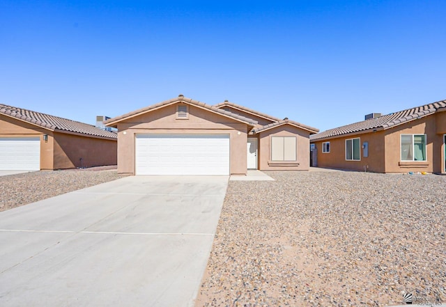 4431 S Buckthorn Dr, Yuma, AZ 85365 - single story home with a garage, driveway, stucco siding, and a tile roof